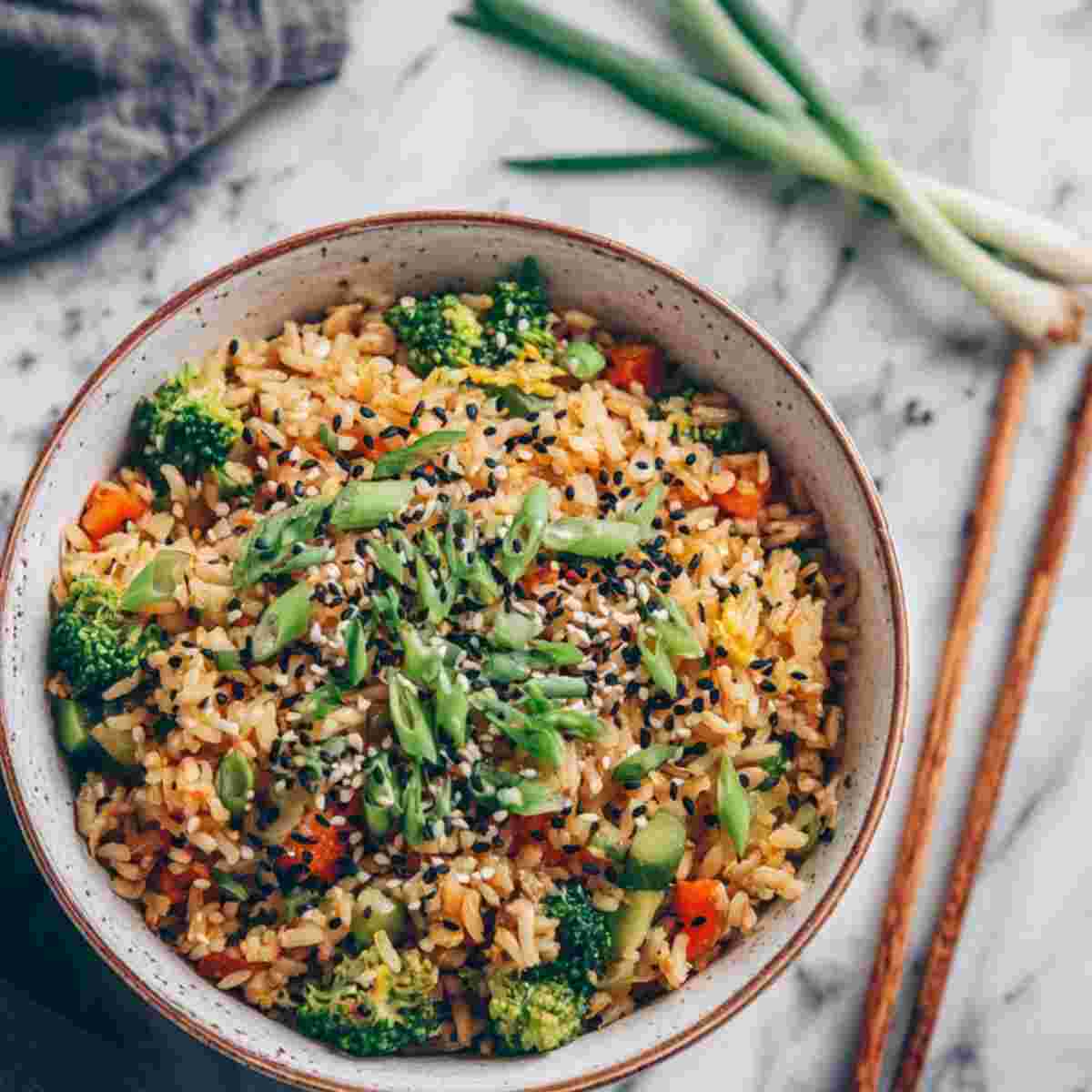 30 Minute Veggie Fried Rice : A quick, vibrant stir-fried rice loaded with broccoli, carrots, peas, and fresh scallions for an easy, flavorful weeknight meal.